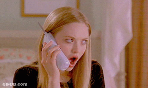 A Woman With A Surprised Look On Her Face Talking On A Cell Phone GIF