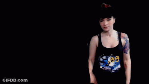 A Woman With A Tattoo On Her Arm And The Words " It 'S Free Real Estate " Behind Her GIF