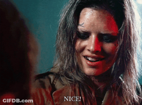 A Woman With A Tattoo On Her Forehead Is Smiling And Says Nice GIF