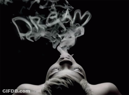 A Woman With A Tattoo On Her Neck Is Smoking GIF