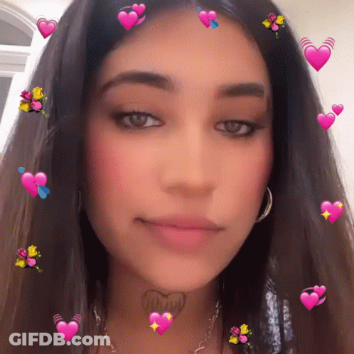 A Woman With A Tattoo On Her Neck That Says " I Love You " GIF