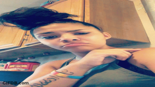 A Woman With A Tattoo On Her Wrist That Says ' I Love You ' GIF