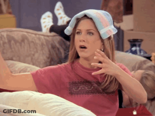 A Woman With A Towel On Her Head Looks Surprised GIF