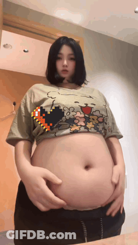 Woman With Large Belly Wearing Crop Top GIF