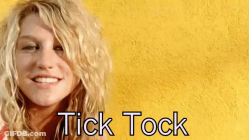 A Woman With A Yellow Background And The Words Tick Tock On It GIF