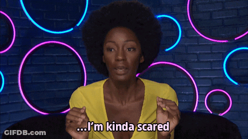 A Woman With An Afro Says I 'M Kinda Scared In Front Of Neon Lights GIF