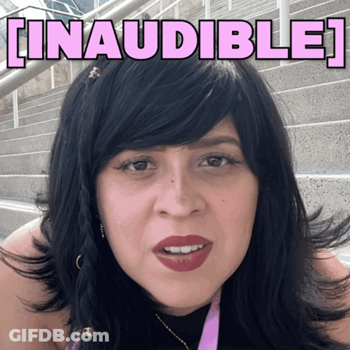 A Woman With Black Hair Is Standing In Front Of A Sign That Says Linausible GIF