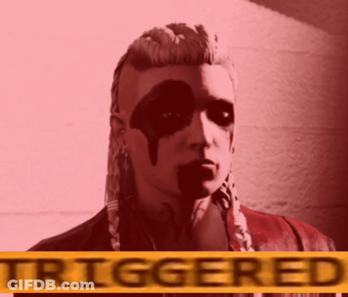 A Woman With Black Paint On Her Face Is Standing In Front Of A Sign That Says Triggered GIF