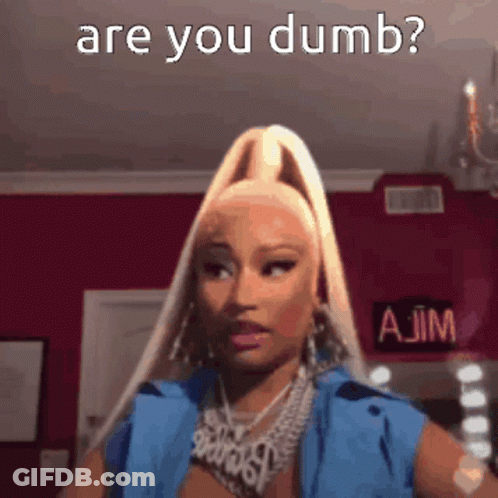 A Woman With Blonde Hair And A Ponytail Is Making A Funny Face And Asking If She Is Dumb . GIF