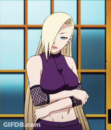 A Woman With Blonde Hair And Blue Eyes Is Standing In Front Of A Window With Her Arms Crossed GIF