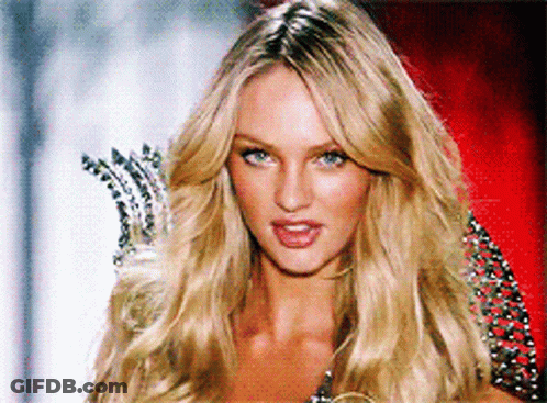 A Woman With Blonde Hair And Blue Eyes Is Wearing A Crown GIF