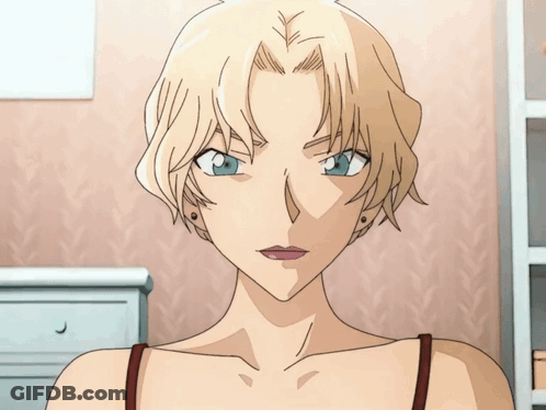 A Woman With Blonde Hair And Blue Eyes Is Wearing A Red Tank Top GIF