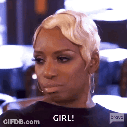 A Woman With Blonde Hair And Hoop Earrings Is Saying Girl GIF
