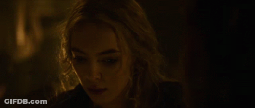 A Woman With Blonde Hair Is Looking At The Camera GIF