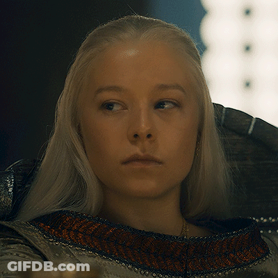 A Woman With Blonde Hair Is Looking At The Camera GIF