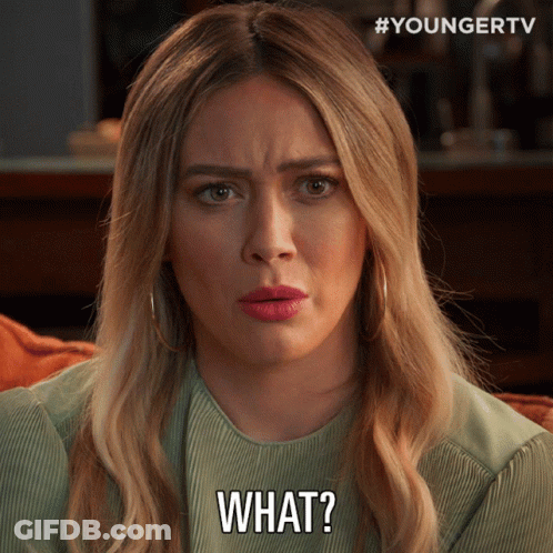 A Woman With Blonde Hair Is Making A Face And Says What GIF