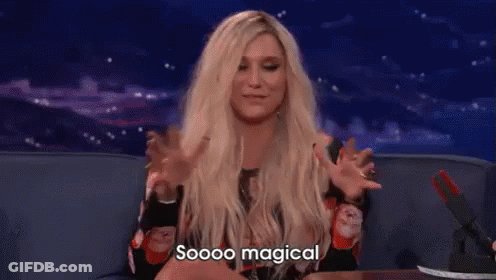 A Woman With Blonde Hair Is Sitting On A Couch With Her Arms Outstretched And Says `` Soooo Magical '' . GIF