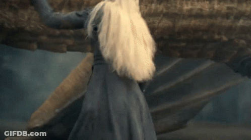 A Woman With Blonde Hair Is Smiling And Looking Up GIF