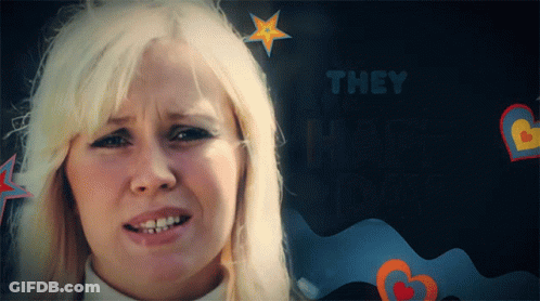 A Woman With Blonde Hair Is Surrounded By Hearts And The Words They Are Happy GIF