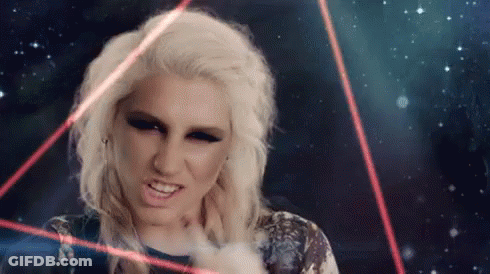 A Woman With Blonde Hair Is Surrounded By Red Lights GIF