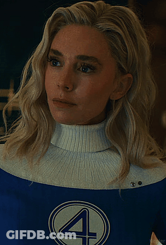 A Woman With Blonde Hair Is Wearing A Blue And White Costume With The Number 4 On It GIF