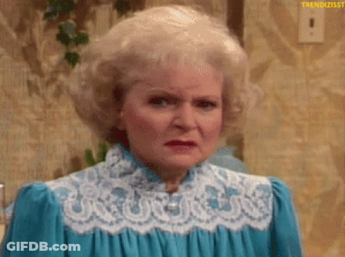 A Woman With Blonde Hair Is Wearing A Blue Dress With White Lace . GIF