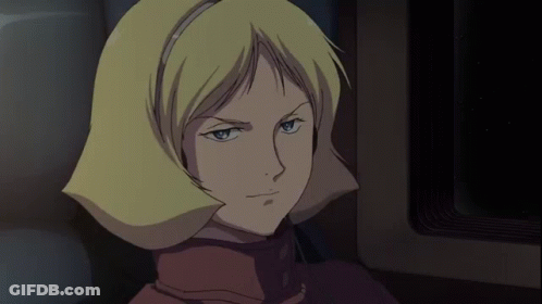 A Woman With Blonde Hair Is Wearing Headphones And Smiling GIF
