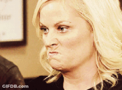 A Woman With Blonde Hair Making A Funny Face With Her Mouth Open GIF