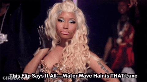 A Woman With Blonde Hair Says This Flip Says It All-Water Wave Hair Is That Luxe GIF