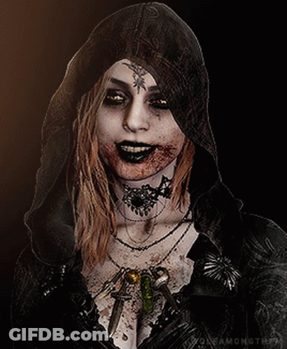 A Woman With Blood On Her Face Is Wearing A Hooded Cape GIF