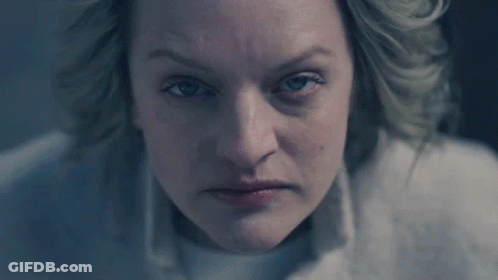 A Woman With Blue Eyes Is Looking At The Camera GIF
