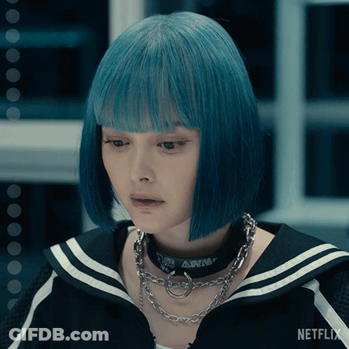 A Woman With Blue Hair And A Netflix Logo On The Bottom Right GIF