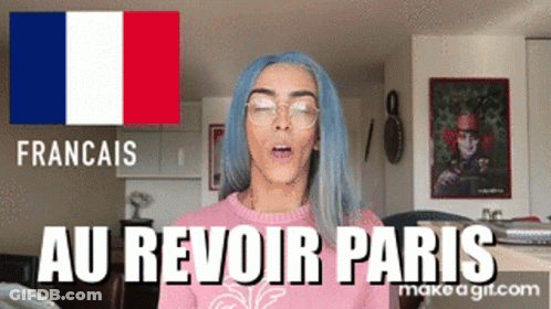 A Woman With Blue Hair And Glasses Is Wearing A Pink Sweater That Says Au Revoir Paris On It GIF