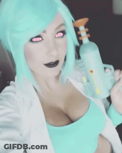 A Woman With Blue Hair And Pink Eyes Is Holding A Gun GIF