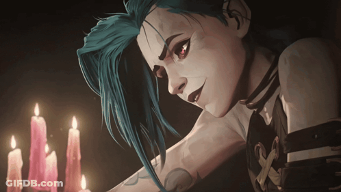 A Woman With Blue Hair And Red Eyes Stands In Front Of Candles GIF