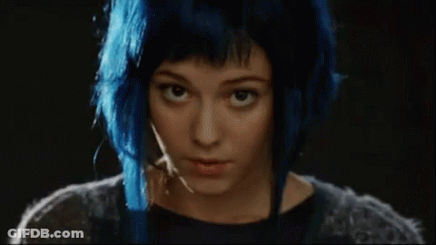 A Woman With Blue Hair Has The Words Hey Hot Stuff On Her Face GIF