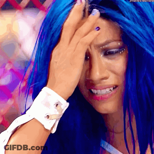A Woman With Blue Hair Is Covering Her Forehead With Her Hand GIF