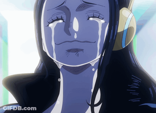 A Woman With Blue Hair Is Crying With A Tear Coming Out Of Her Eye GIF