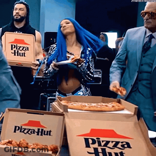 A Woman With Blue Hair Is Holding A Pizza Hut Pizza Box GIF