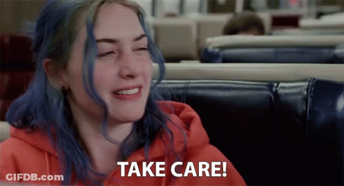 A Woman With Blue Hair Is Sitting In A Diner And Saying Take Care GIF