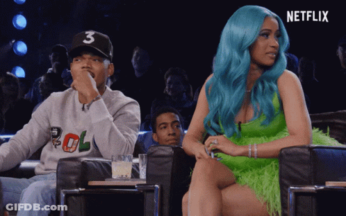A Woman With Blue Hair Is Sitting Next To A Man Wearing A Number 3 Hat GIF