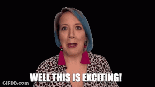 A Woman With Blue Hair Is Smiling And Saying Well This Is Exciting ! GIF