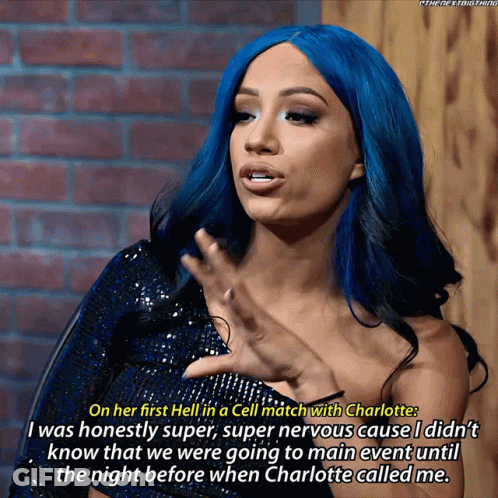 A Woman With Blue Hair Is Talking About A Cell Match With Charlotte GIF