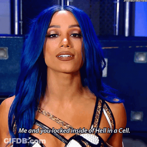 A Woman With Blue Hair Is Talking About Being Locked Inside Of Hell In A Cell GIF