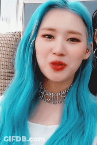 A Woman With Blue Hair Is Wearing A Choker That Says ' Shine ' On It GIF