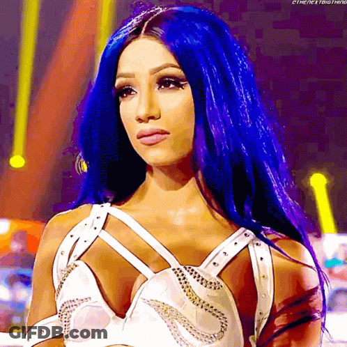 A Woman With Blue Hair Is Wearing A White Top With Studs GIF