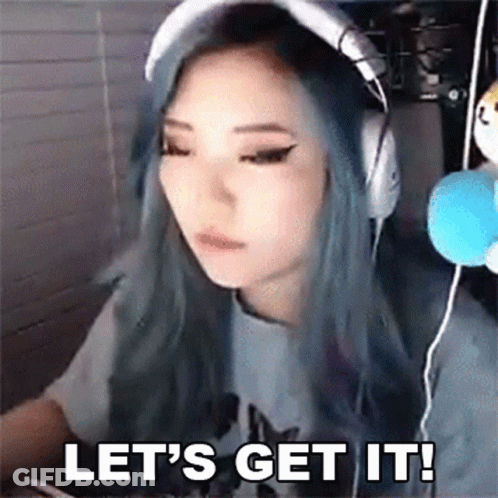 A Woman With Blue Hair Is Wearing Headphones And Says Let 'S Get It ! GIF