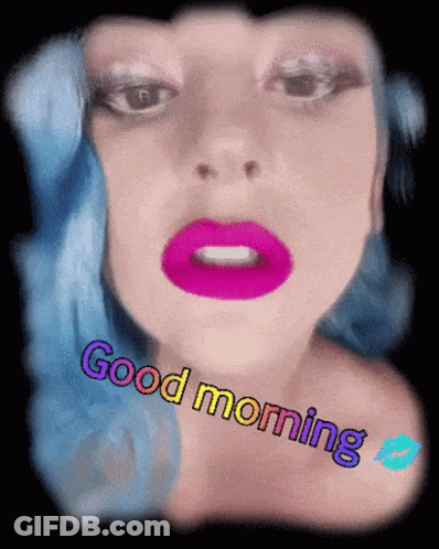 A Woman With Blue Hair Says Good Morning With A Kiss GIF