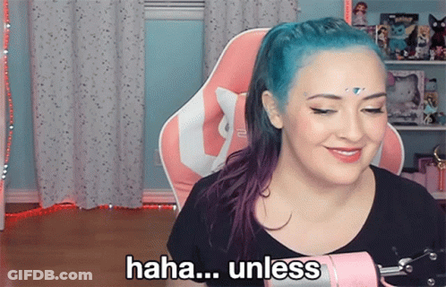 A Woman With Blue Hair Says " Haha Unless " In Front Of A Pink Microphone GIF