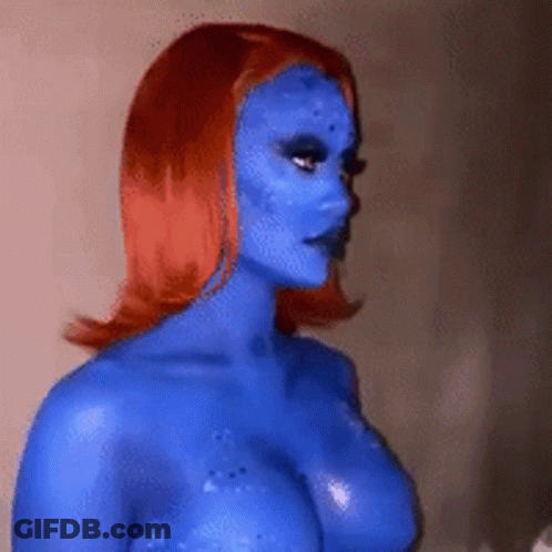 A Woman With Blue Paint On Her Face And Body GIF